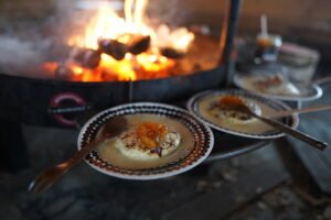 desert with cloudberry jem on plate around fire